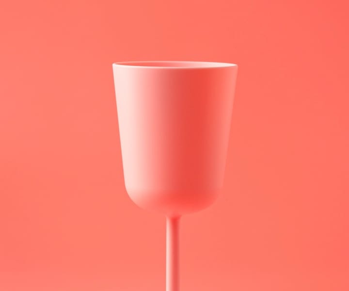 A pink cup in a pink background